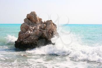 Royalty Free Photo of a Wave Crashing Into Rocks in the Mediterranean Sea