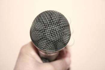 Royalty Free Photo of a Person Holding a Microphone