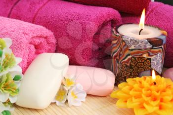 Royalty Free Photo of Soap and Candles by Towels