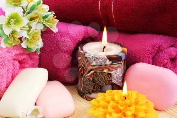 Royalty Free Photo of Candles and Soap by Towels