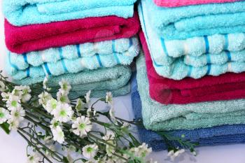 Royalty Free Photo of Flowers by Towels