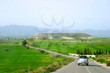 Royalty Free Photo of a Car on a Road in Cyprus