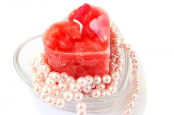 Royalty Free Photo of a Candle and Pearls