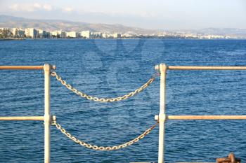 Royalty Free Photo of a Chain Fence on the Pier
