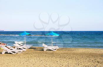 Royalty Free Photo of Chairs on the Beach
