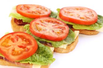 Sandwiches with bacon, lettuce and  tomato.