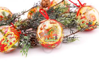 Christmas balls with fir tree branch isolated on white background.