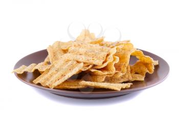 Wheat chips on plate isolated on white background.
