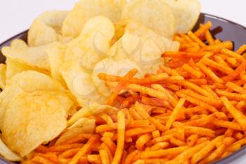 Potato chips in bowl, closeup image.