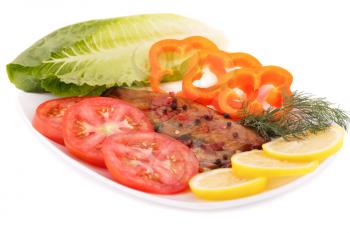 Smoked fish with fresh vegetables and lemon isolated on white background.