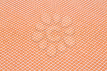 Checkered tablecloth texture as a background, closeup picture.