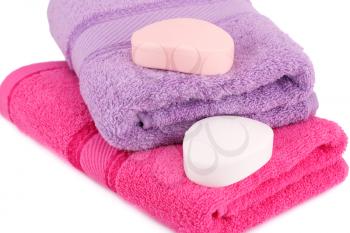 Colorful towels and soaps  on white background.