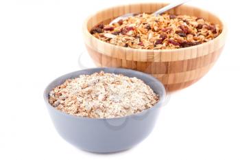 Muesli in the bowls isolated on white background.
