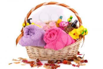 Spa set with towels, creams, lotions and flowers isolated on white background.