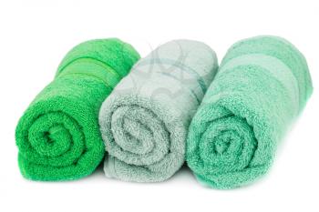 Rolled colorful towels isolated on white background.