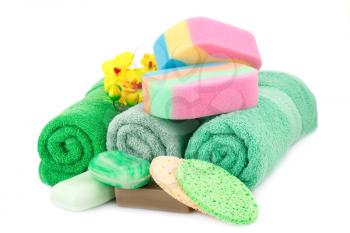 Spa set with towels, soaps, sponges and orchid flowers isolated on white background.