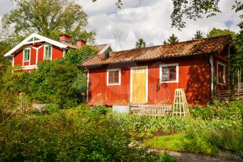 Traditional wooden houses at Skansen, the first open-air museum and zoo, located on the island Djurgarden in Stockholm, Sweden.