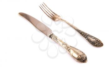 Vintage knife and fork isolated on white background.