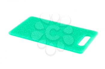 Green plastic cutting board isolated on white background.