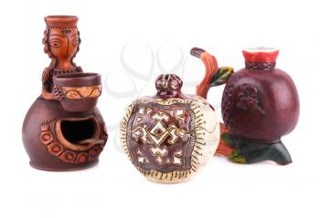 Armenian ancient doll souvenir for salt and pepper, pomegranate, cup isolated on white background.