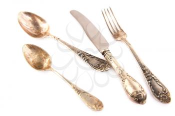 Vintage spoons, knife and fork isolated on white background.
