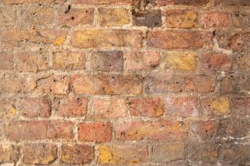 The texture of the brown bricks wall as a background.