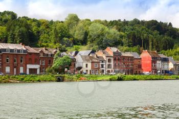 Houses in Dinant, view from Meuse river in Belgium.