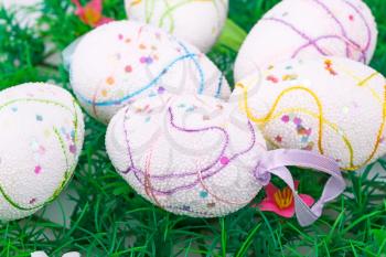 Easter eggs decoration on artificial grass background.