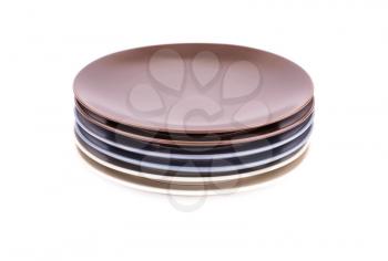 Stack of colorful plates isolated on white background.