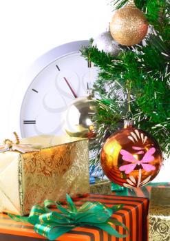 New Year and Christmas Tree and gift boxes, clock . Isolated over white background.