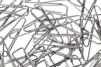 Lot of paper clips against a white background.Isolated