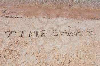 Inscription TimeShare on a sand n a  beach.