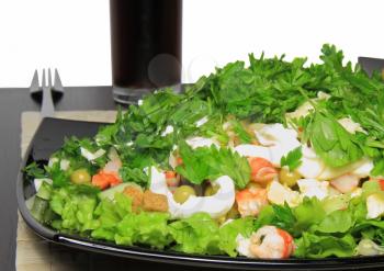 Salad with shrimps, dried crust, leaf of lettuce and fizz drink. isolated