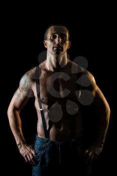 Sexy macho man with black suspenders