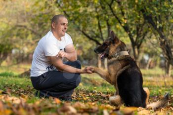 Man With Dog German Shepherd