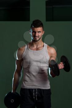 Muscular Man Exercising Biceps