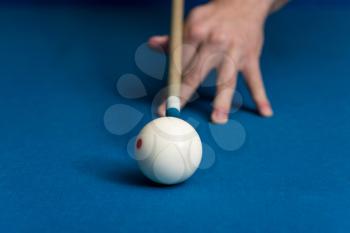 Man Playing Pool About to Hit Ball