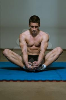 Athletic Man Stretches