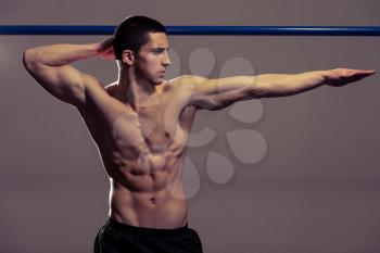 Young Muscular Men Flexing Muscles
