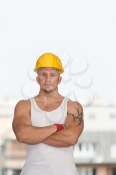 Portrait Of Handsome Engineer With Yellow Helmet