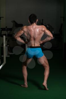 Body Builder Performing Back Lat Spread Poses