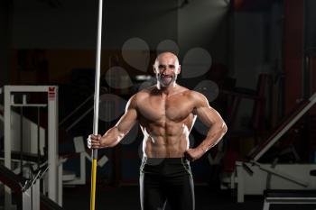 Portrait Of A Physically Fit Mature Male With Javelin