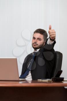 Happy Smiling Cheerful Business Man With Thumbs Up Gesture