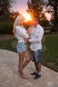 Young Couple In Love Outdoor - Stunning Sensual Outdoor Portrait Of Young Stylish Fashion Couple Posing In Summer In Field