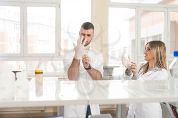 Group Of High School Students Working Together At Laboratory Class