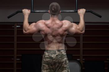 Adult Male Athlete Doing Pull Ups - Chin-Ups In The Gym - Best Exercise For Back