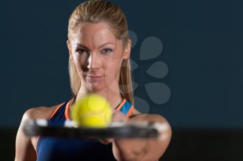Close-up On Female Tennis Player Holding Racket With Ball