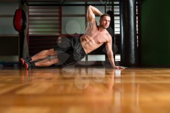 Exercising Abs Side Plank Hip Raise Abdominal Crunch In Fitness Club