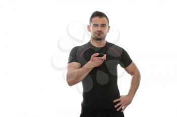 Handsome Personal Trainer With Stopwatch Isolated On A White Background