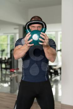 Man Working Out With Kettle Bell In A Gym - Bodybuilder Doing Heavy Weight Exercise With Kettle-bell
